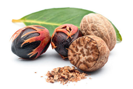 Nutmeg (Myristica fragrans), Myristicaceae. Spice, fresh nut with mace. On white background.