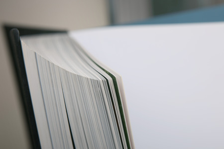Abstract background with turning pages. Macro view book pages with empty blue place.