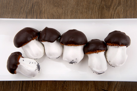 Cookies mushrooms glazed in white and brown chocolate. Sweet homemade mushroom shaped cookies in...
