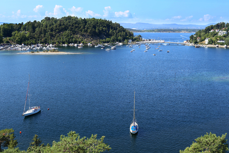 Oslo, Norway - July 22, 2018: View to Oslo Fjord. Two islands Ormoya and Malmoya connected to the mainland by bridge, just east of the city center.のeditorial素材