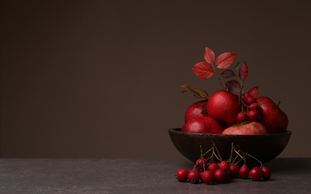 Background with berries and apples in plate. Fruits and berries with empty place.の写真素材