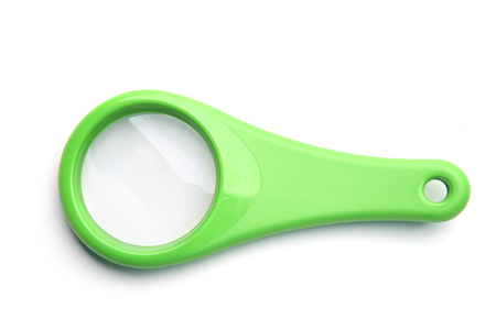 Green magnifying glass isolated on white background. Plastic loupe on white background.の写真素材