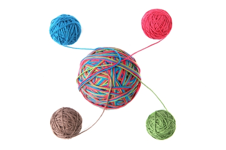 Colorful cotton big thread ball from four color thread isolated on white background. Different color...
