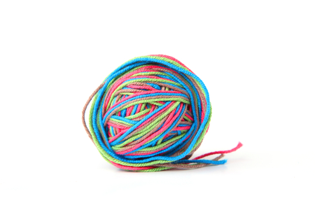 Colorful cotton thread ball on white background. Different color pink, green, gray, blue thread mix.の写真素材