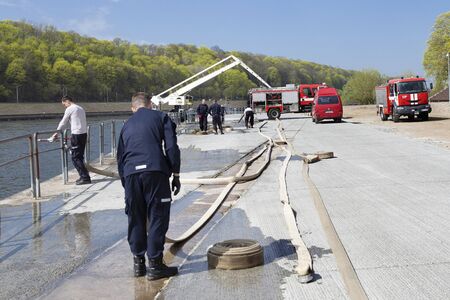 Kaunas, Lithuania â€“ April 25, 2019: Fire brigade  during an emergency exercise. Firefighters...