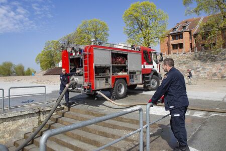 Kaunas, Lithuania â€“ April 25, 2019: Fire brigade  during an emergency exercise. Firefighters...