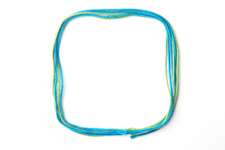 Colorful rectangular  frame made of thread isolated on white background. Empty frame of cotton thread.の写真素材