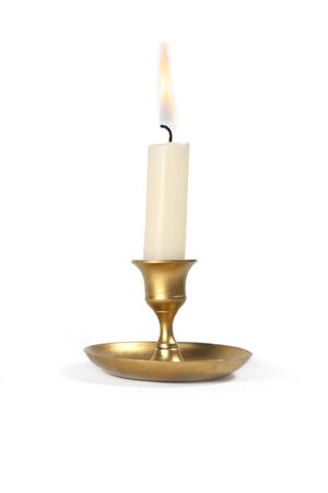 Burning  candle in golden vintage candlestick isolated on white background.

の写真素材