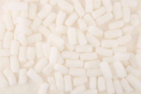 foam packing peanuts  background. White plastic foam pellets protective for parcel packing.の写真素材