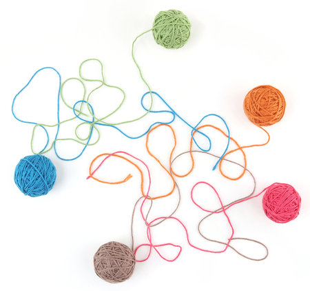 Colorful cotton thread balls isolated on white background. Set of five color (orange, pink, grey,...