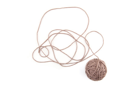 Brown cotton thread balls isolated on white background. Abstract thread lines and thread ball.