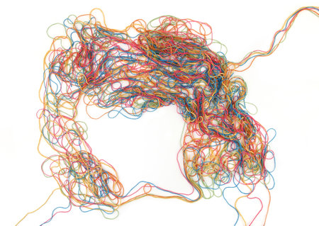 Tangled colorful cotton threads isolated on white background. Abstract thread lines chaos pattern.