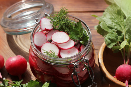 Glass Jar with Pickled Radishesの写真素材
