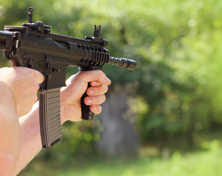 soldier  shoot at a target with automatic weapon