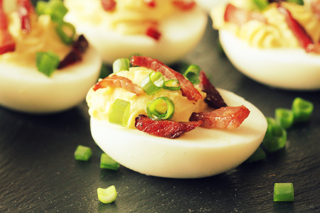 Bacon Deviled Eggs on black backgroundの写真素材