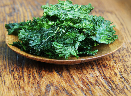Homemade Organic Green Kale Chips with salt and oilの写真素材