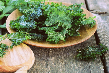 Homemade Organic Green Kale Chips with salt and oil .の写真素材
