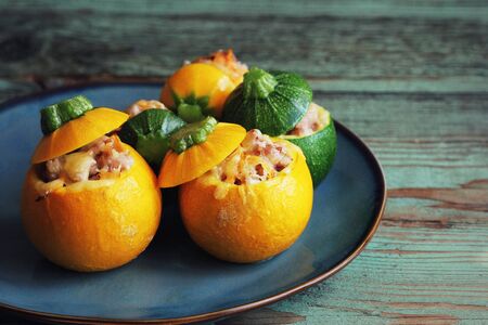 Baked round zucchini stuffed with minced meat, vegetables, and cheeseの写真素材