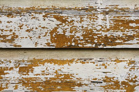 Grunge background. Peeling white paint on an old wooden wall .の写真素材