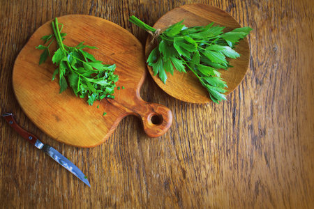 Lovage herb on cutting board. Woden backgroundの写真素材