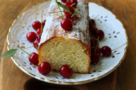 Home made cherry biscuits with vanilla and icing sugar .