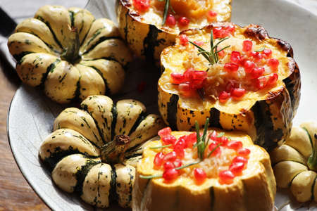 Pumpkin risotto served in a hollowed pumpkin. Baked pumpkin with cheese and pomegranate seeds ....
