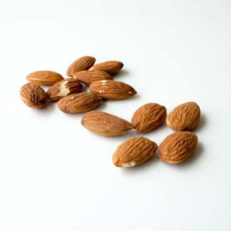 Composition of almonds isolated on a white background