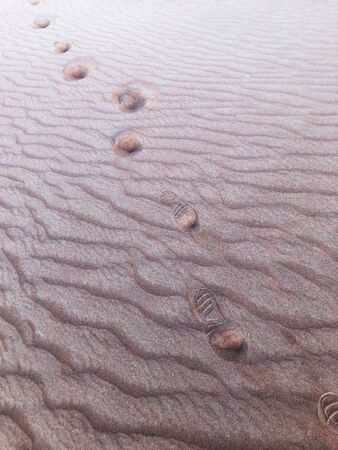 Footprint shoe on desert sand, UAE.の写真素材
