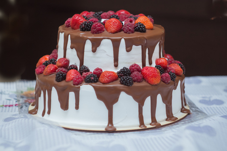 cake with chocolate and sweet summer berriesの写真素材
