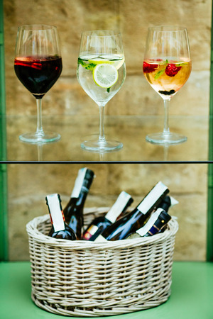sangria and lemonade on a wooden barrel with flowers makes your evening wonderfulの写真素材