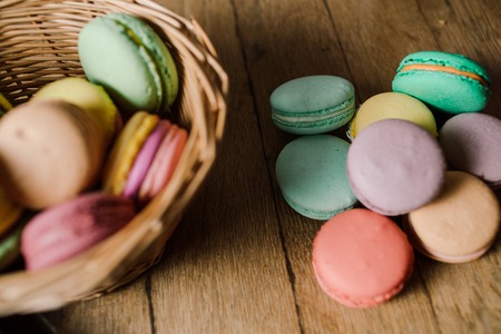vivid color macaroons on wooden tableの写真素材