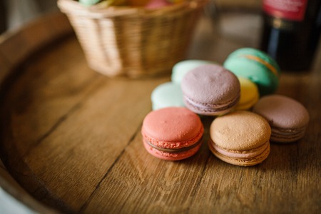 vivid color macaroons on wooden tableの写真素材