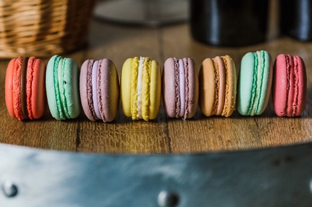 Cake macaron or macaroon on turquoise background from above, colの写真素材