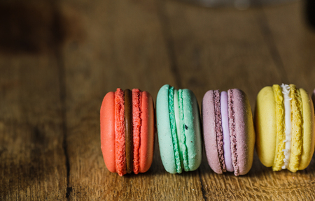 Cake macaron or macaroon on turquoise background from above, colの写真素材