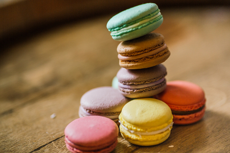 Cake macaron or macaroon on turquoise background from above, colの写真素材