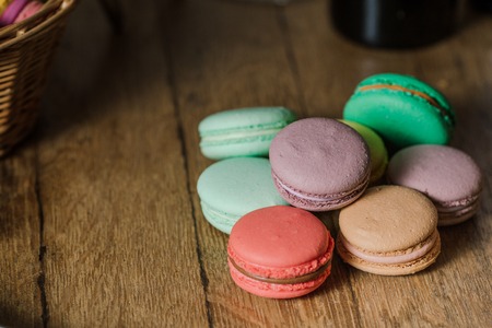 vivid color macaroons on wooden tableの写真素材