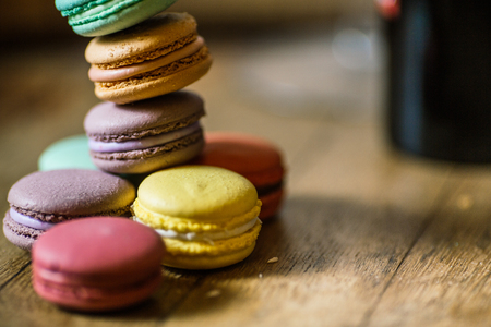 Cake macaron or macaroon on turquoise background from above, colの写真素材