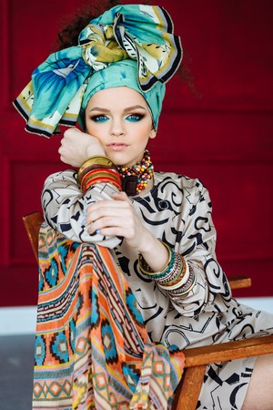 Young beautiful girl with big bracelets and necklacesの写真素材