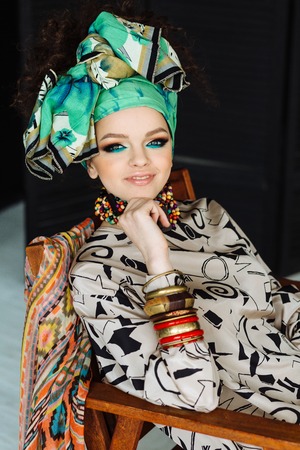 Young beautiful girl with big bracelets and necklacesの写真素材