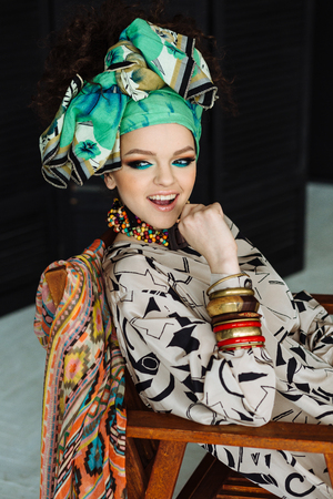 Young beautiful girl with big bracelets and necklacesの写真素材