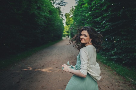 Happy Lifestyle portrait of a beautiful young model girl walkingの写真素材