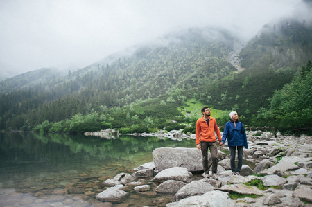 Traveler couple in love enjoying the mountainsの写真素材