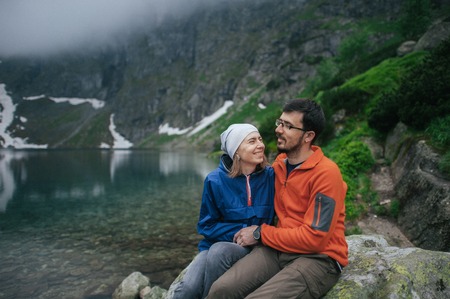 Traveler couple in love enjoying the mountainsの写真素材