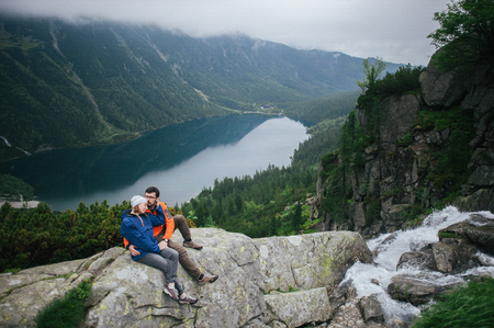 Traveler couple in love enjoying the mountainsの写真素材