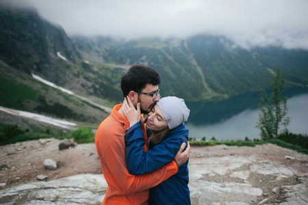 Traveler couple in love enjoying the mountainsの写真素材