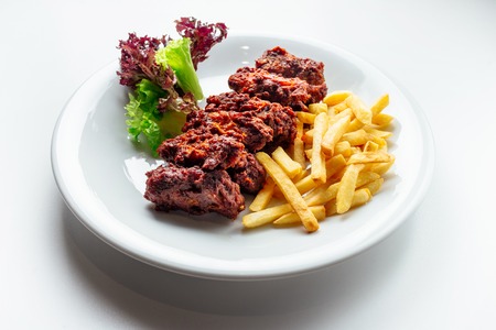 meat and fried and potatoesの写真素材