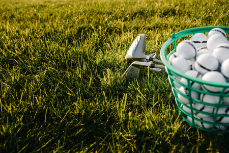 Playing golf - shot of golf ball with golf clubの写真素材