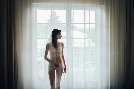 beautiful gorgeous stylish bride with orchids getting prepared iの写真素材
