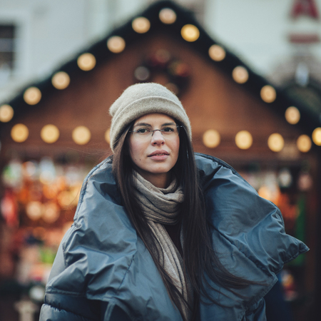 Street portrait of smiling beautiful young woman Model looking aの写真素材