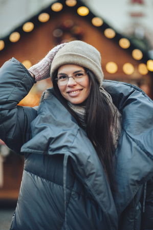 Portrait of beautiful girl with long hair wearing warm winter clの写真素材